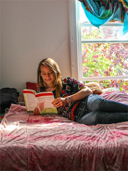 A Cooper studying in their bedroom.
